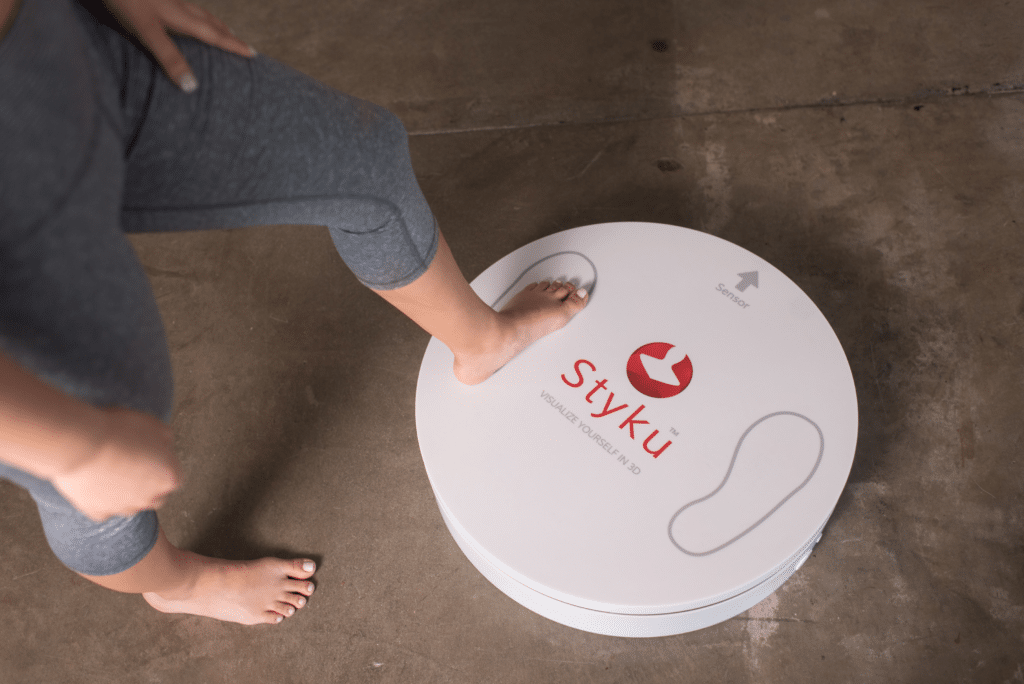 Styku 3D Body Scanning in Batesville, AR 1 Stepping on Scanner